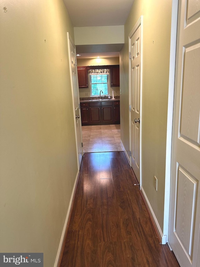 413 Park View Dr, Harrisburg, PA 17110 - hall with dark wood-type flooring, a sink, and baseboards