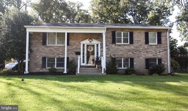 517 Crosby Rd, Baltimore, MD 21228 - raised ranch featuring a front yard and brick siding