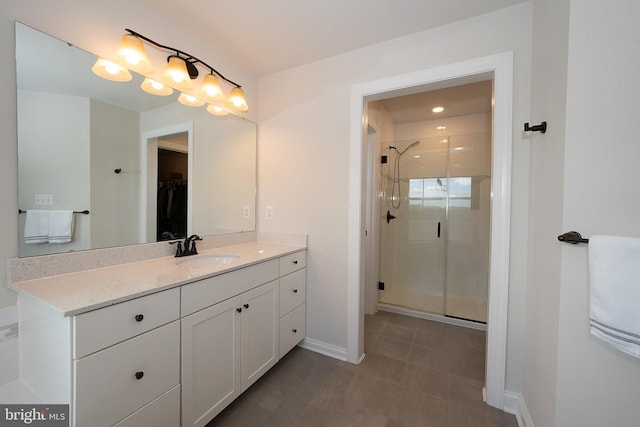 500 Quarry Point Rd, Malvern, PA 19355 - bathroom featuring vanity, a stall shower, a spacious closet, and baseboards