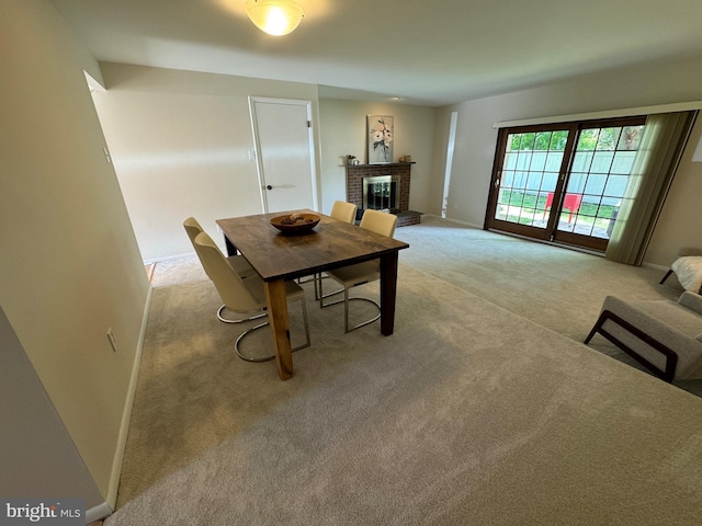 315 S Valley Forge Rd Unit 7, Devon, PA 19333 - dining room featuring light carpet, a brick fireplace, and baseboards