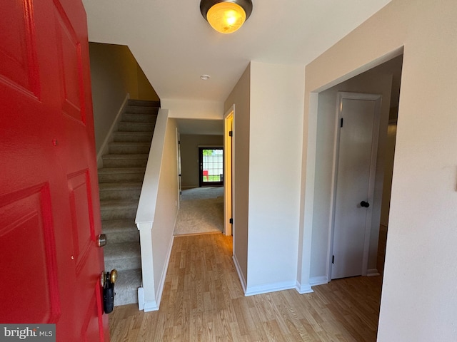 315 S Valley Forge Rd Unit 7, Devon, PA 19333 - foyer with light wood finished floors, baseboards, and stairway