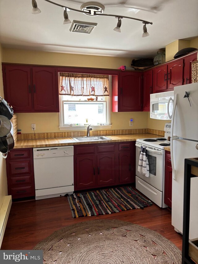 43 Magnolia Rd, Manahawkin, NJ 08050 - kitchen featuring white appliances, a sink, dark wood finished floors, light countertops, and rail lighting