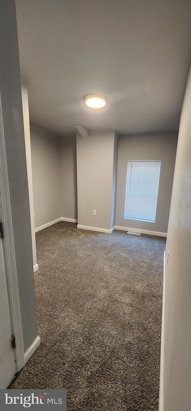 538 Mcmechen St, Baltimore, MD 21217 - spare room with baseboards and carpet flooring