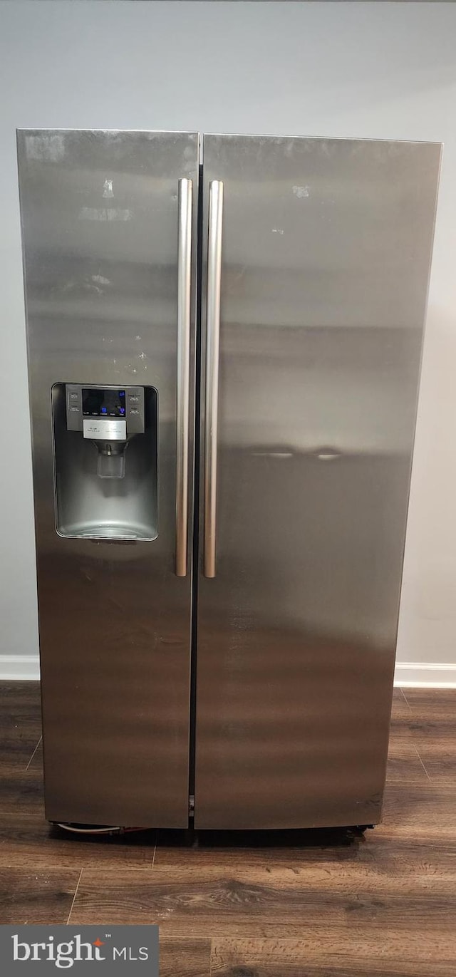 538 Mcmechen St, Baltimore, MD 21217 - kitchen view of stainless steel fridge with ice dispenser, baseboards, and wood finished floors