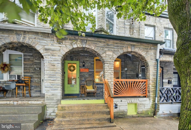 134 N Plum St, Lancaster, PA 17602 - view of exterior entry featuring stone siding and a porch