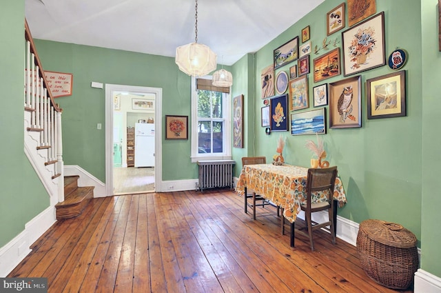 134 N Plum St, Lancaster, PA 17602 - entrance foyer featuring radiator heating unit, stairway, hardwood / wood-style flooring, and baseboards