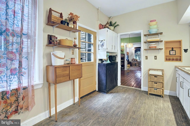 134 N Plum St, Lancaster, PA 17602 - kitchen featuring open shelves, wood finished floors, white cabinetry, and baseboards