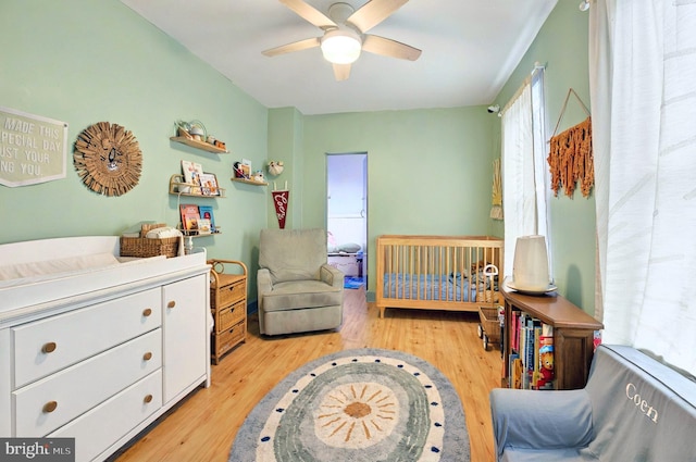 134 N Plum St, Lancaster, PA 17602 - bedroom with light wood-style flooring, a nursery area, and ceiling fan