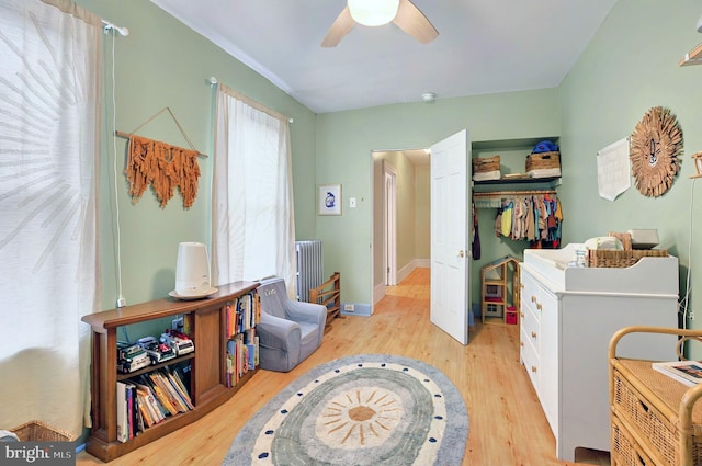 134 N Plum St, Lancaster, PA 17602 - bedroom featuring light wood finished floors, radiator, ceiling fan, and a closet