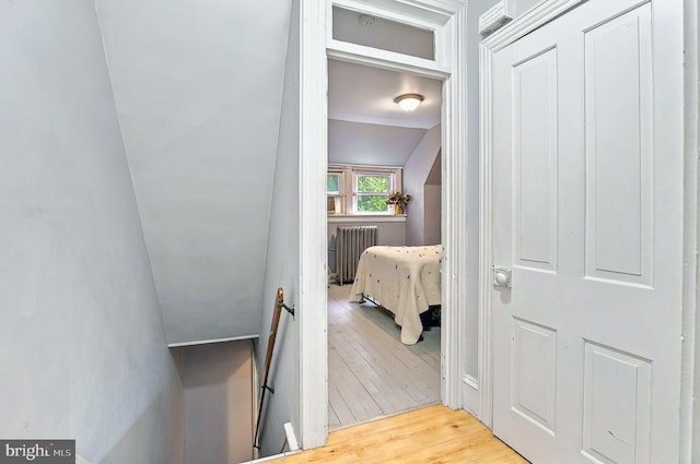 134 N Plum St, Lancaster, PA 17602 - hallway with an upstairs landing, light wood-style floors, and radiator