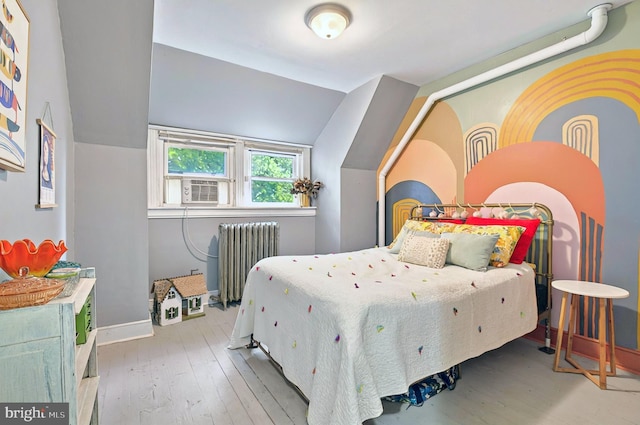 134 N Plum St, Lancaster, PA 17602 - bedroom with radiator heating unit, hardwood / wood-style flooring, baseboards, and vaulted ceiling