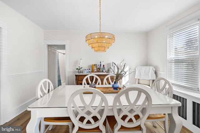 27 E Groveland Ave, Somers Point, NJ 08244 - dining space with wood finished floors, a chandelier, and ornamental molding