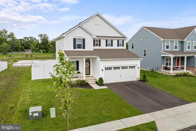 138 Merseyside Dr, Woolwich Twp, NJ 08085 - traditional home featuring a porch, driveway, and a garage