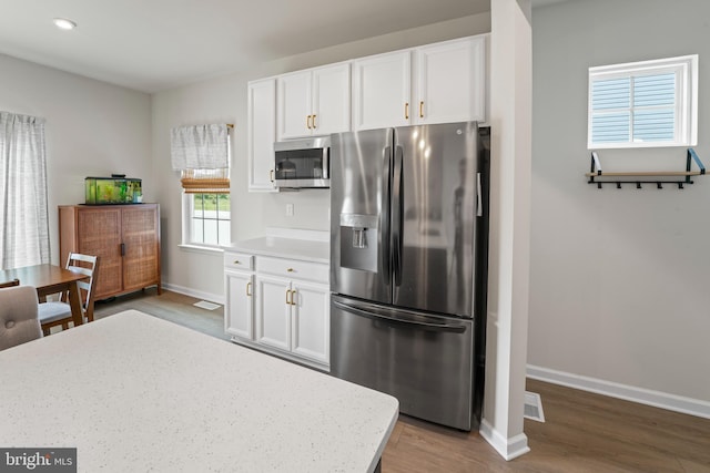 138 Merseyside Dr, Woolwich Twp, NJ 08085 - kitchen featuring appliances with stainless steel finishes, wood finished floors, white cabinetry, and baseboards