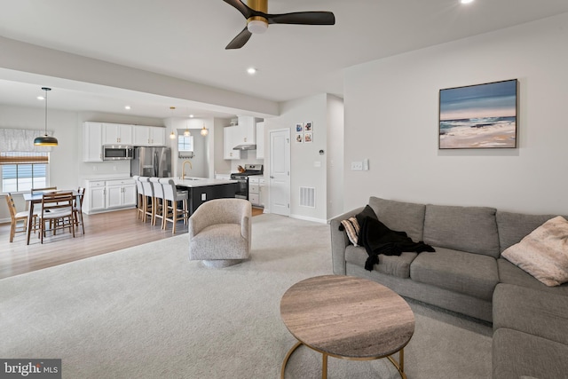 138 Merseyside Dr, Woolwich Twp, NJ 08085 - living area featuring ceiling fan, light colored carpet, plenty of natural light, and recessed lighting