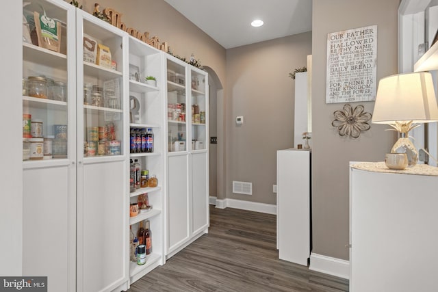 500 Prince George Dr, Lancaster, PA 17601 - hall with baseboards, dark wood-type flooring, arched walkways, and recessed lighting