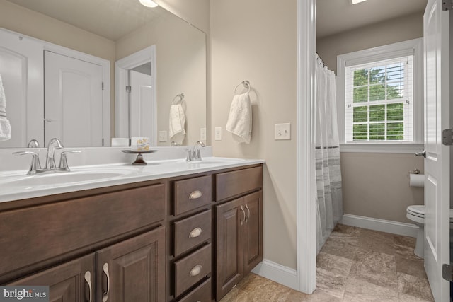 500 Prince George Dr, Lancaster, PA 17601 - full bath featuring baseboards, double vanity, and toilet