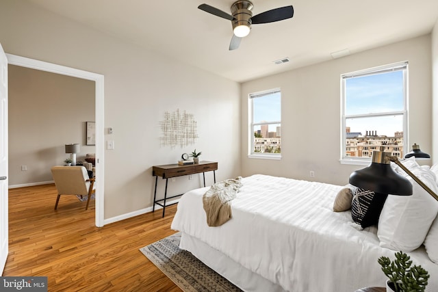 23 Pierside Dr Unit 429, Baltimore, MD 21230 - bedroom featuring wood finished floors, baseboards, and ceiling fan