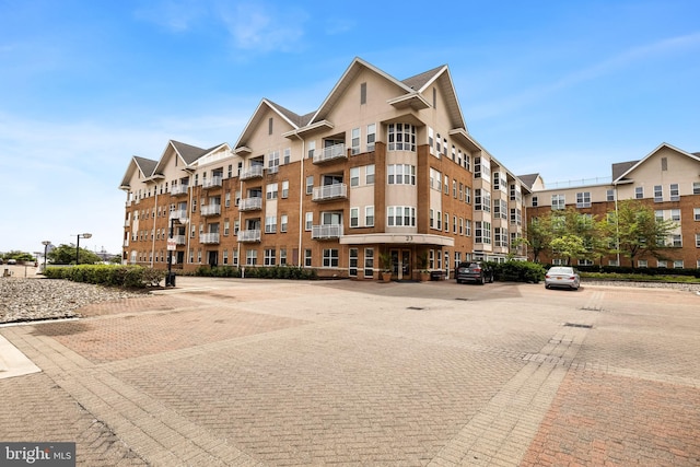 23 Pierside Dr Unit 429, Baltimore, MD 21230 - view of building exterior featuring uncovered parking