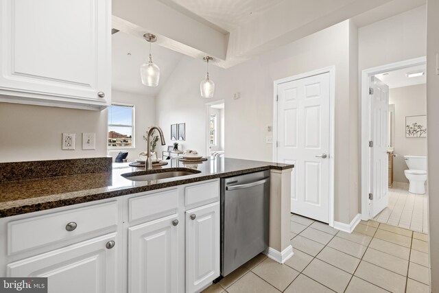 23 Pierside Dr Unit 429, Baltimore, MD 21230 - kitchen featuring stainless steel dishwasher, a sink, light tile patterned flooring, white cabinetry, and dark stone countertops