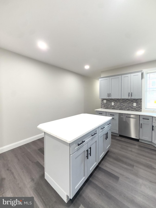 1736 E 30th St, Baltimore, MD 21218 - kitchen featuring dishwasher, dark wood-style flooring, backsplash, light countertops, and recessed lighting