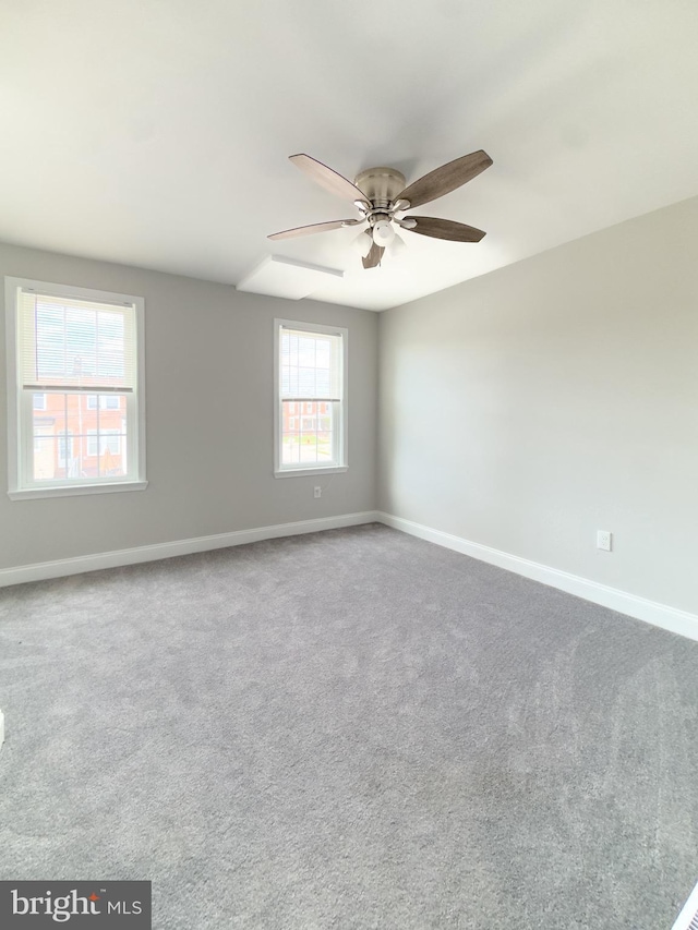 1736 E 30th St, Baltimore, MD 21218 - empty room with a ceiling fan and carpet