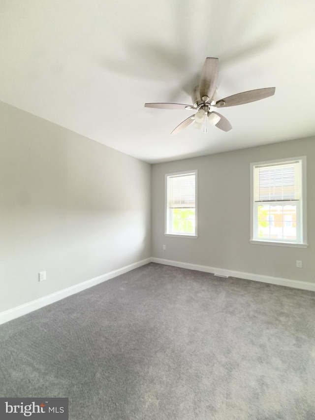 1736 E 30th St, Baltimore, MD 21218 - spare room with ceiling fan and carpet flooring