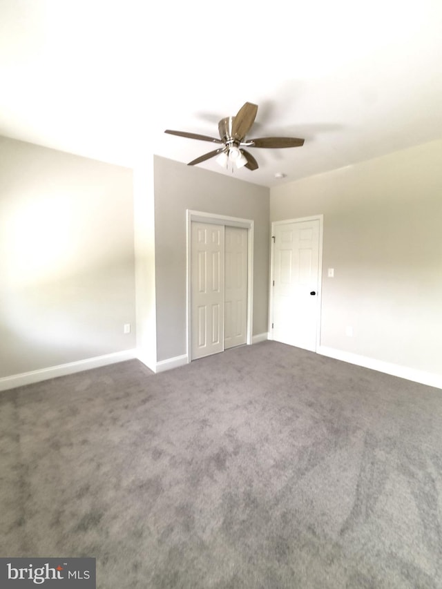 1736 E 30th St, Baltimore, MD 21218 - unfurnished bedroom with carpet, ceiling fan, and a closet