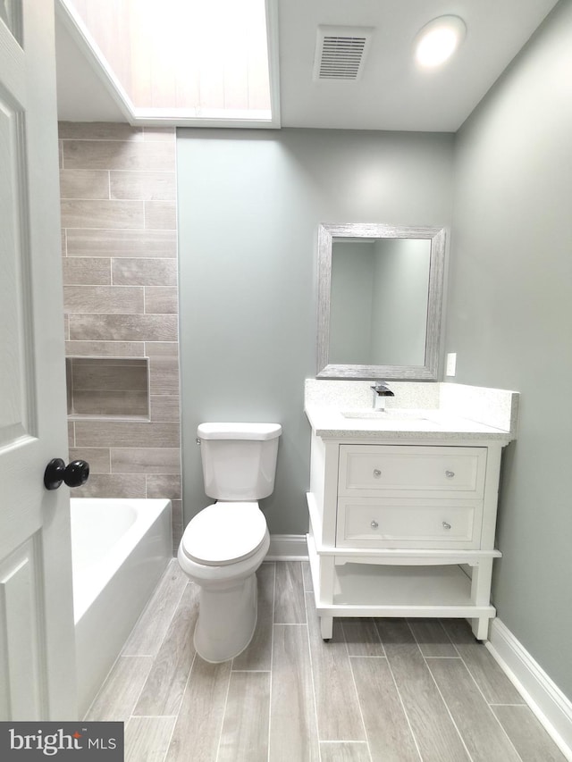 1736 E 30th St, Baltimore, MD 21218 - bathroom featuring vanity and wood tiled floors