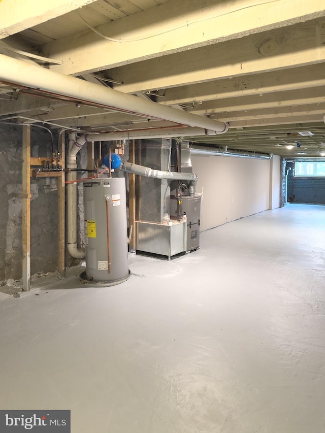 1736 E 30th St, Baltimore, MD 21218 - unfinished basement featuring electric water heater and heating unit