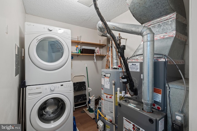 82 Cheverny Ct, Hamilton, NJ 08619 - laundry area featuring stacked washer and clothes dryer, gas water heater, wood finished floors, a textured ceiling, and heating unit