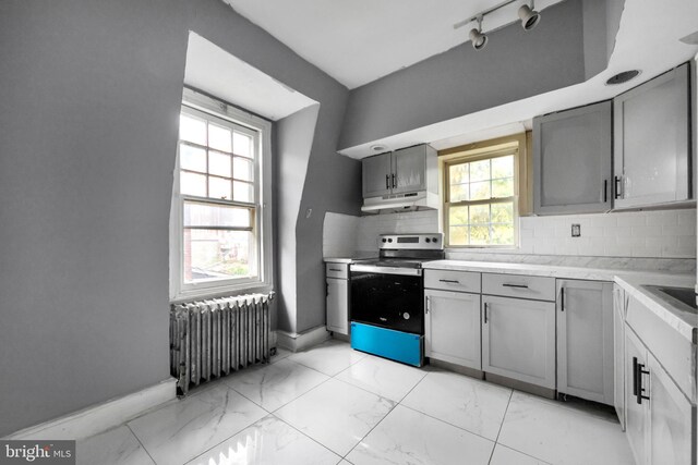 36 N Millbourne Ave, Upper Darby, PA 19082 - kitchen featuring stainless steel electric range, radiator, gray cabinets, and under cabinet range hood