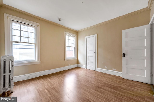 36 N Millbourne Ave, Upper Darby, PA 19082 - empty room featuring ornamental molding, wood finished floors, radiator heating unit, and baseboards
