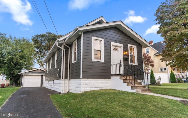 3258 N 48th St, Pennsauken, NJ 08109 - view of front of property with an outdoor structure, a garage, and asphalt driveway