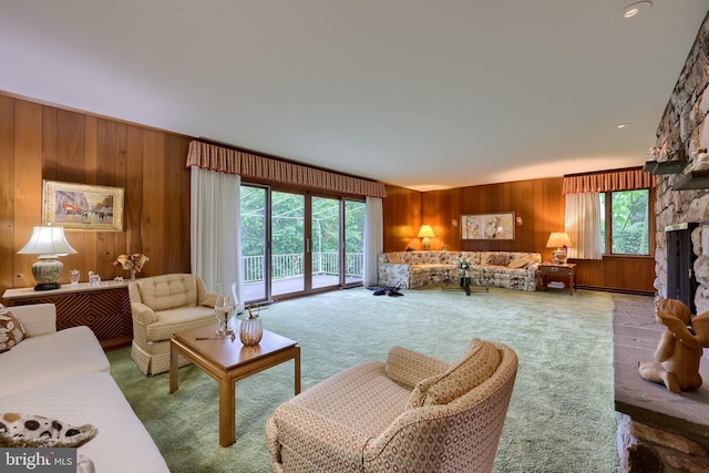 1545 Farr Rd, Wyomissing, PA 19610 - living area featuring wooden walls, carpet floors, and a stone fireplace