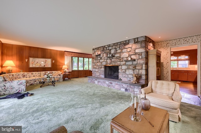 1545 Farr Rd, Wyomissing, PA 19610 - carpeted living area featuring wooden walls and a stone fireplace