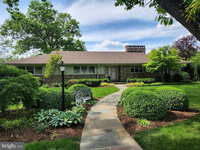 1545 Farr Rd, Wyomissing, PA 19610 - ranch-style house with stone siding, a chimney, and a front yard