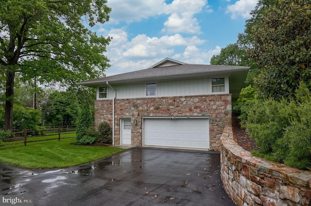 1545 Farr Rd, Wyomissing, PA 19610 - view of side of home featuring driveway, stone siding, an attached garage, and a shingled roof