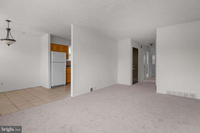 210 Erica Ter, Philadelphia, PA 19116 - empty room with light colored carpet, a textured ceiling, and light tile patterned flooring