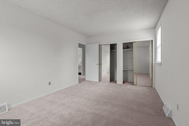 210 Erica Ter, Philadelphia, PA 19116 - unfurnished bedroom featuring carpet floors, a textured ceiling, a closet, and baseboards