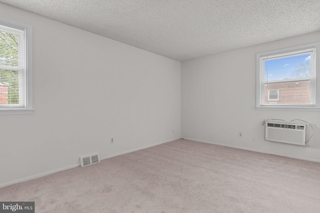 210 Erica Ter, Philadelphia, PA 19116 - spare room with carpet flooring, a textured ceiling, a wall unit AC, and baseboards