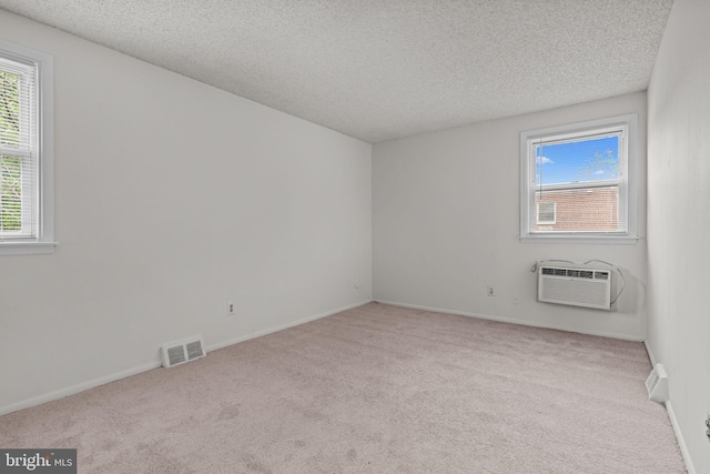 210 Erica Ter, Philadelphia, PA 19116 - empty room with an AC wall unit, carpet floors, a textured ceiling, and baseboards