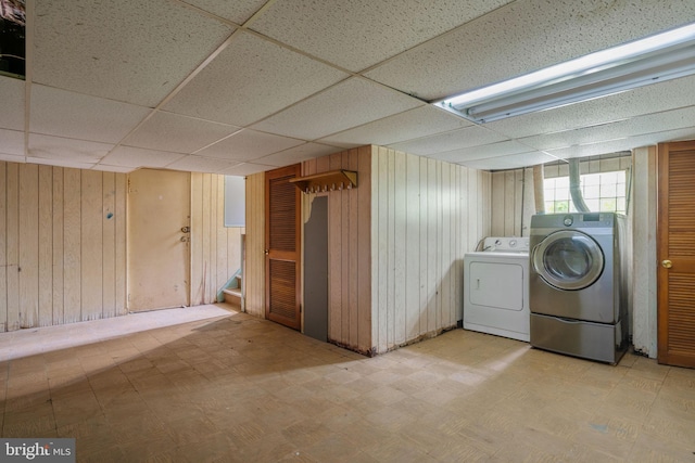 210 Erica Ter, Philadelphia, PA 19116 - washroom with tile patterned floors, washing machine and clothes dryer, and wood walls