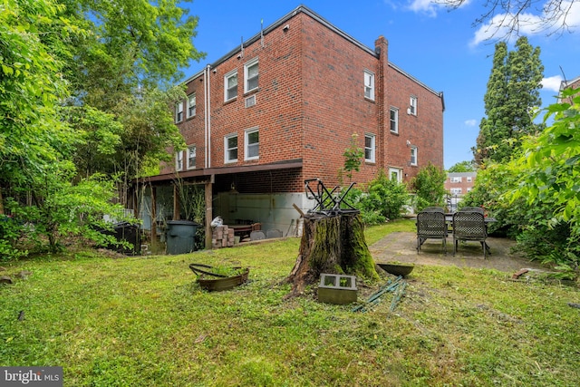 210 Erica Ter, Philadelphia, PA 19116 - rear view of property featuring a lawn and brick siding
