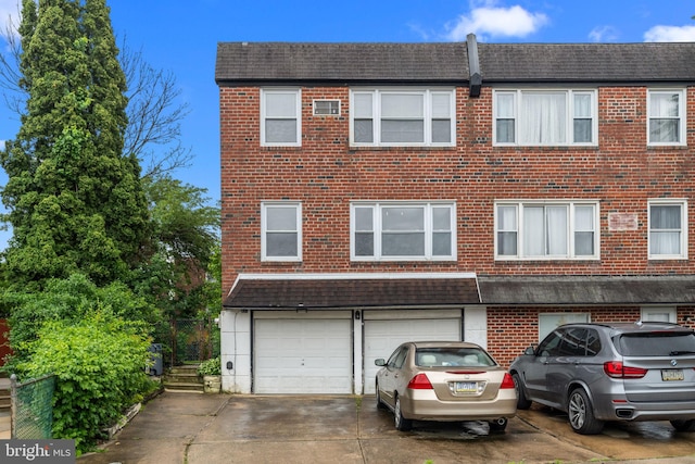 210 Erica Ter, Philadelphia, PA 19116 - view of property with an attached garage, driveway, brick siding, and a shingled roof