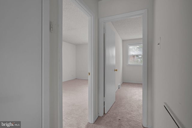 210 Erica Ter, Philadelphia, PA 19116 - corridor featuring a textured ceiling and light colored carpet