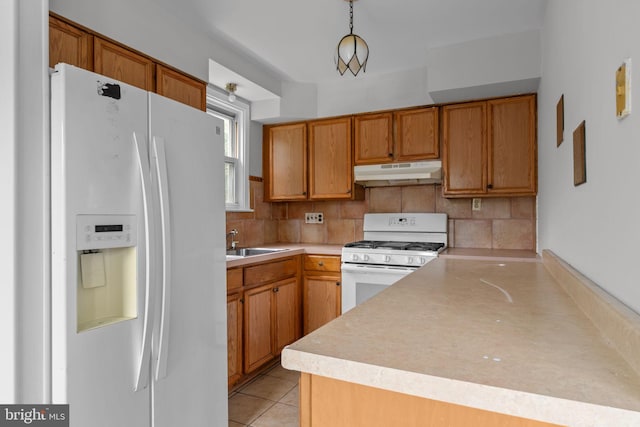 210 Erica Ter, Philadelphia, PA 19116 - kitchen with white appliances, under cabinet range hood, a sink, and light countertops