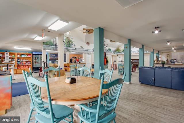 12133 Neale Sound Dr, Cobb Island, MD 20625 - dining room featuring wood finished floors, vaulted ceiling, and a ceiling fan