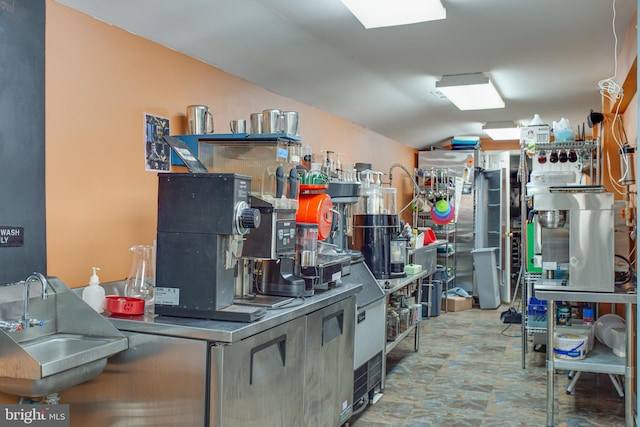 12133 Neale Sound Dr, Cobb Island, MD 20625 - kitchen featuring a sink and lofted ceiling