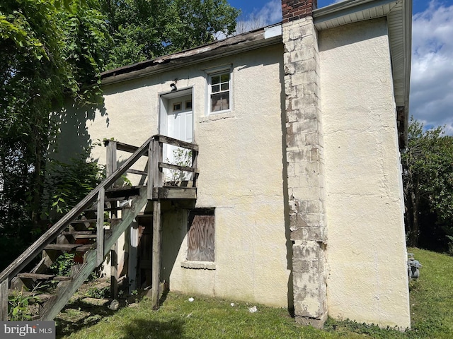 510 62nd Ave, Capitol Heights, MD 20743 - view of property exterior featuring stucco siding and stairway